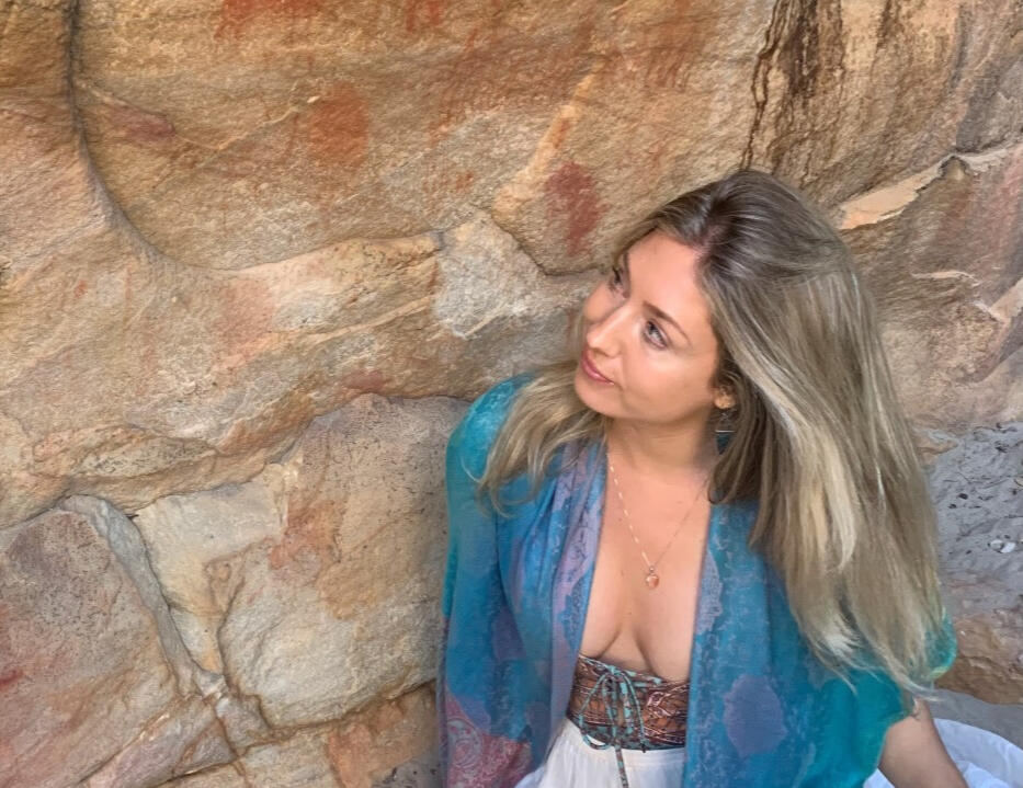 Kim Milner-Lunt beside San anciant rock art paintings, Cederberg Mountains
